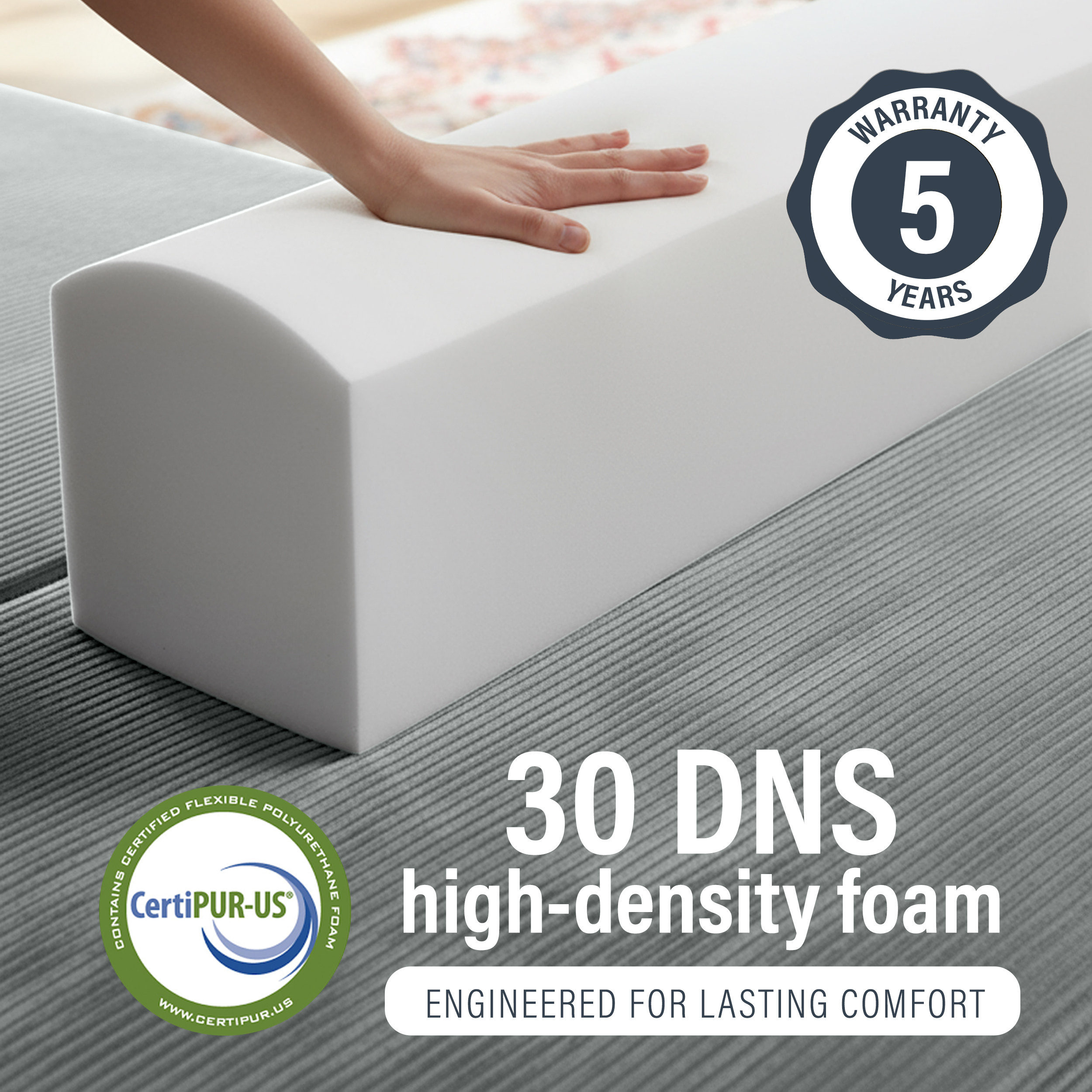 Image of hand pressing into 30 DNS high-density foam with 5 year warranty.