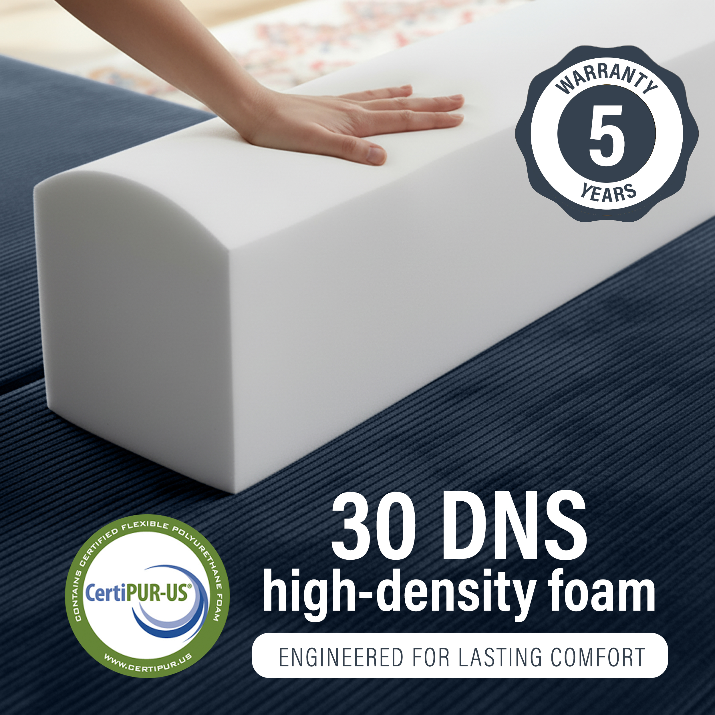 Image of hand pressing into 30 DNS high-density foam with 5 year warranty.