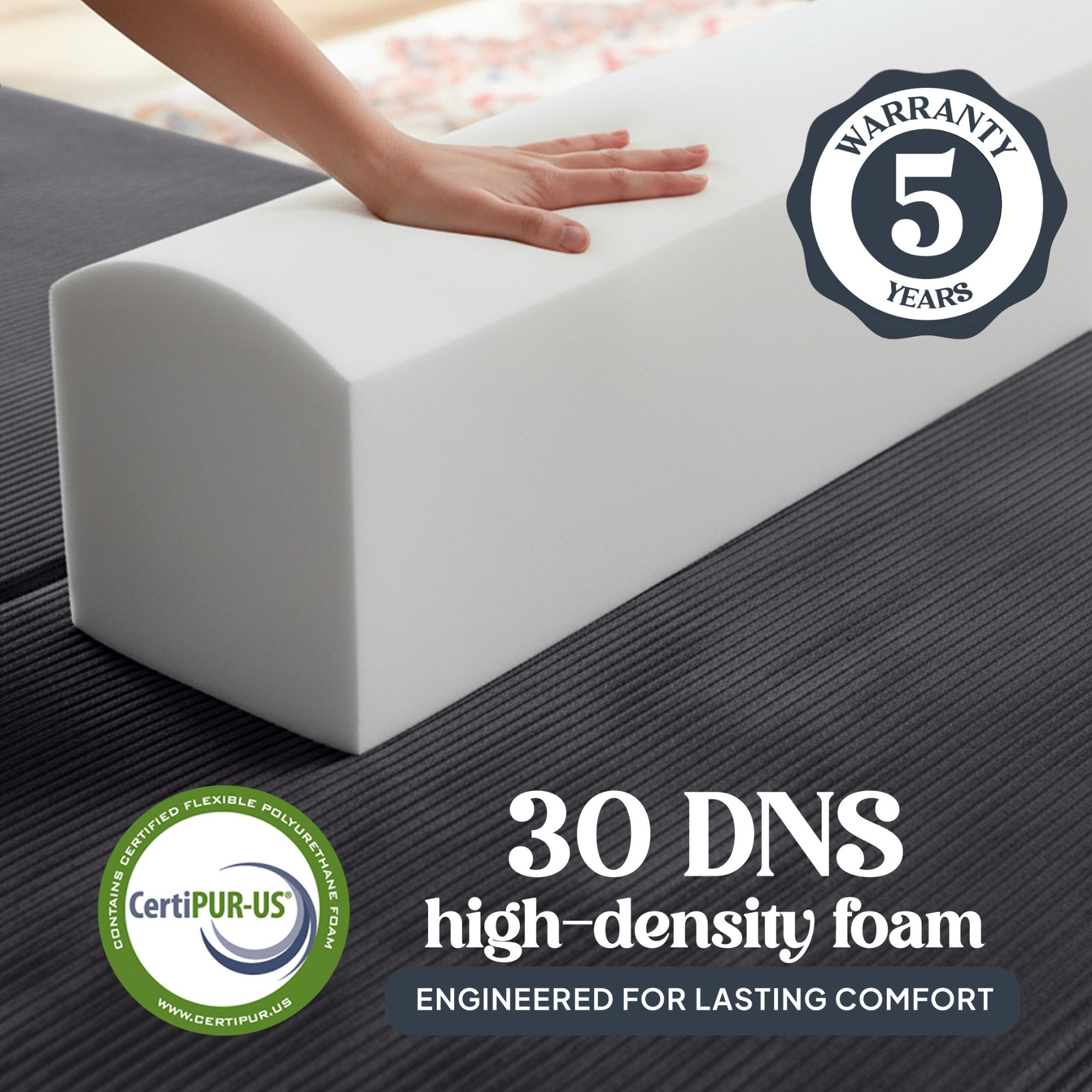Image of hand pressing into 30 DNS high-density foam with 5 year warranty.