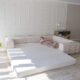 A large pull out couch with full size bed.