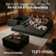 Image of family sitting on black boneless couch with black ottoman in living room