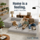 Family sitting on gray boneless sofa in expandable configuration.