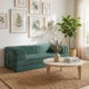 Green boneless sofa in living room.