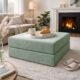 Modular ottoman with tray with coffee and pastries on it in living room.