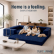 Family sitting on navy blue boneless sofa in expandable configuration with feet on navy blue foam ottoman.