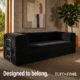 Black boneless modular couch sitting in living room.